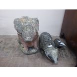 Three Composite Stone Garden Figures, the first being a seated pig, approx 50 x 24 x 40 cms and a
