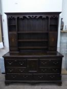 A 19th Century Oak Welsh Dresser, the dresser features a panelled back with three Delft rests,