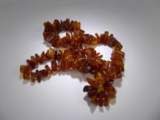 A Vintage Graduated Rough Amber Necklace, approx 62 cms, approx 56 gms.