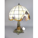 A Tiffany-Style Lamp with Art Nouveau-design coloured glass shade, approx 45 x 33 cms.
