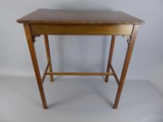 A Mahogany Occasional Table carved with notches carved to sides, straight stretchers and legs,