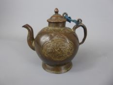 An Antique Chinese Bronze Wine Kettle. The kettle having decorated cartouche with lotus form cover.