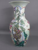 An Early 20th Century Chinese Famille Rose Vase, hand painted with scenes of The Chinese New Year