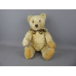 A Circa 1950 Steiff White Bear, with button to the right ear, this Steiff bear features a swivel