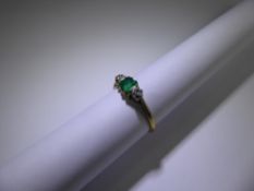 A Vintage 18ct and Platinum Yellow Gold Diamond and Emerald Ring, 2 x 5 pts dias, 4 mm emerald, size