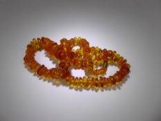 A Vintage Graduated Amber necklace, approx 50 cms, approx 27.4 gms.