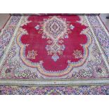 A Large 20th Century Persian Wool Carpet, ruby and pale blue, pink and purple ground of foliate