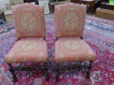 A Pair of Antique Mahogany Baronial Hall Chairs, with carved stretchers and feet, upholstered in