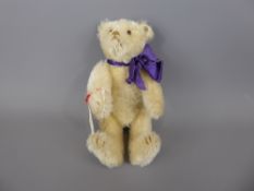 A Circa 1913 White Steiff Teddy Bear, with original button to right ear, approx 18 cms, this