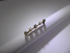 An Antique 18ct (tested) Yellow Gold Diamond and Pearl Bar Brooch. 1 x 30 pt and 2 x 18 pt old cut