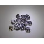 A Set of Twelve Silver Thistle Buttons, five large and seven small. London hallmark, dated 1900,