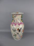A Chinese Hand-Painted Famille Rose Vase depicting peonies and birds with relief Salamanders to