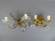 A Pair of Gilded-Brass Wall Lights (two bulb) decorated with cut-glass drops and almonds together