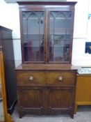 An Antique Mahogany Bureau Book Case, double cupboards beneath a fall-front pull out appointed desk,