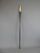 An Antique Rosewood & Carved Kongo Ivory Handled Cane, the cane carved in the form of an European