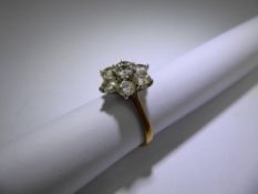 An 18ct Yellow and White Gold Diamond Cluster Ring, approx 2.3 ct of dias, size N.