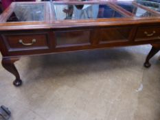 A Rosewood Display Table, the table with a glazed lift top, approx 120 x 56 x 48 cms.