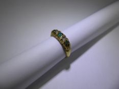 A Vintage 18ct Emerald and Diamond Ring. 2 x 7 pt dias, 1 x 3.5 mm and 2 x 2.5 mm ems, size M,