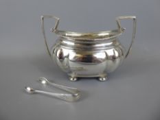 A Twin Handled Sugar Bowl and Sugar Nips, Chester hallmark, dated 1908, approx 240 gms.