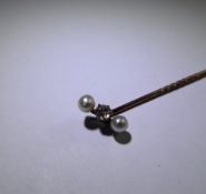 An Antique Gentleman's 9ct Yellow Gold (tested) Diamond and Pearl Tie Stick. Approx 18 pt old cut