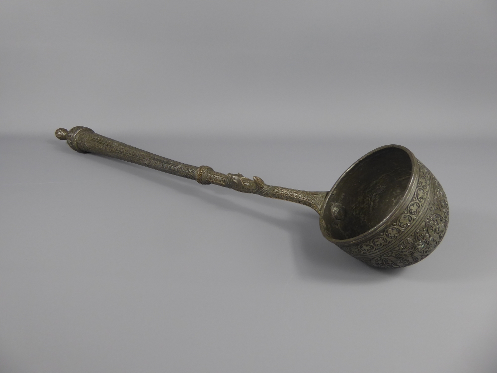 An Antique Pewter Ladle, incised with foliate decoration, possibly Ottoman, approx 55 cms.
