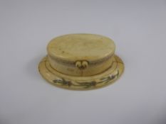 A 19th Century Ivory & Bone Snuff Box, the oval box having coloured design depicting flowers to both