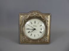 A Carr's Bedside Clock, the clock contained within a silver frame, dated 1996.