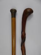 A Simple Walking Cane with twisted shaft together with a malacca walking cane with horn-style