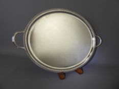 A Silver Handled Salver, Sheffield hallmark, mm JNL, dated 1975, approx 1046 gms.