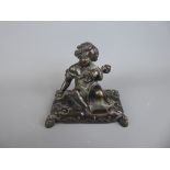 A Bronze Figurine, depicting a little girl seated on a pillow with her doll, approx 10 x 7 x 10
