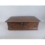 A Circa 18th Century Oak Bible Box. The box carved with the letters A W to top with carved front