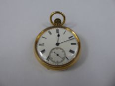 An 18ct Yellow Gold Gentleman's Open Face Pocket Watch. The watch having a white enamel face with