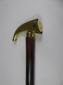 An Antique Walking Stick with a curved brass handle.