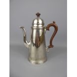 A Sterling Silver Coffee Pot, with fruit wood handle and finial, Birmingham hallmark, dated 1977, mm