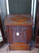 A Mahogany Ornately Carved Coal Scuttle, with drop front drawer.