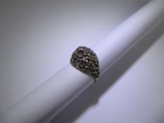 A Vintage 18ct White Gold and Diamond 1960's Bark Finish Ring. 1 x 7 pt dia, 12 pts dias, size L,