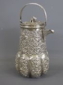 An Indian Silver Coffee Pot, with foliate decoration, approx 16 cms, approx 228 gms.