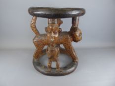 A West African Cameroon Stool, carved with leopards and two figures.