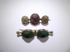 An Antique 9ct Gold (tested) Scarab Beetle Brooch, together with a three stone white metal cameo