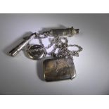 A Silver Chain, with a silver whistle London hallmark, locket, silver and amber cigarette holder and