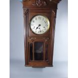 A German Kienzle Large Oak Wall Clock, approx 94 x 39 x 18 cms.