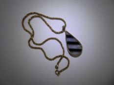 A 9ct Gold Black Onyx and White Quartz Tear Drop Pendant, suspended from a 9 ct gold fancy rope