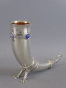 A Silver Toasting Horn, the horn inset with blue cabachon stones, mm A E Jones, Birmingham hallmark,