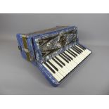 A Vintage Geraldo Italia 120 Bass 30 Key Piano Accordion, in working order, in blue mother of