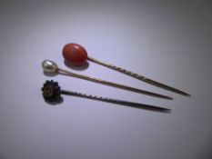 Three Antique Tie Pins, including pearl 18ct (tested), coral 14ct (tested) and rose cut diamond 14ct