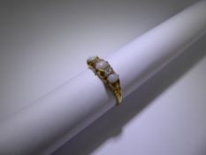 An 18ct Yellow Gold Diamond and Opal Ring, 2 x 10 pt old cut dias, 5 x 3 mm centre opal, 2 x 4 x 3