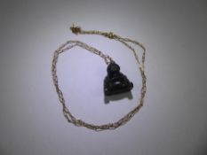 A Dark Green Carved Jade Buddha Pendant on 9ct yellow gold chain, chain approx 1.7 gms.