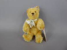 A Circa 1930's Steiff White Teddy Bear, with original button and full white ear tag, approx 15