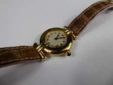 A Lady's 18ct Lady's Yellow Gold Cartier Quartz Wrist Watch, the watching having a white stippled