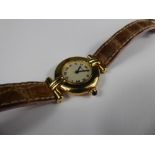 A Lady's 18ct Lady's Yellow Gold Cartier Quartz Wrist Watch, the watching having a white stippled